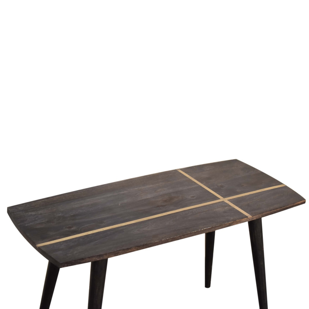 Table basse en frêne noir incrustée de laiton